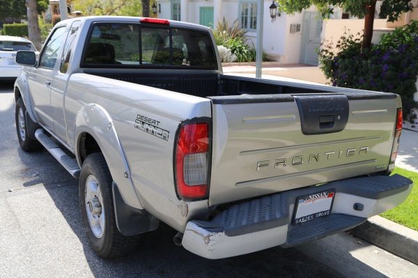 Photo of our truck showing dent in rear bumper and scratches