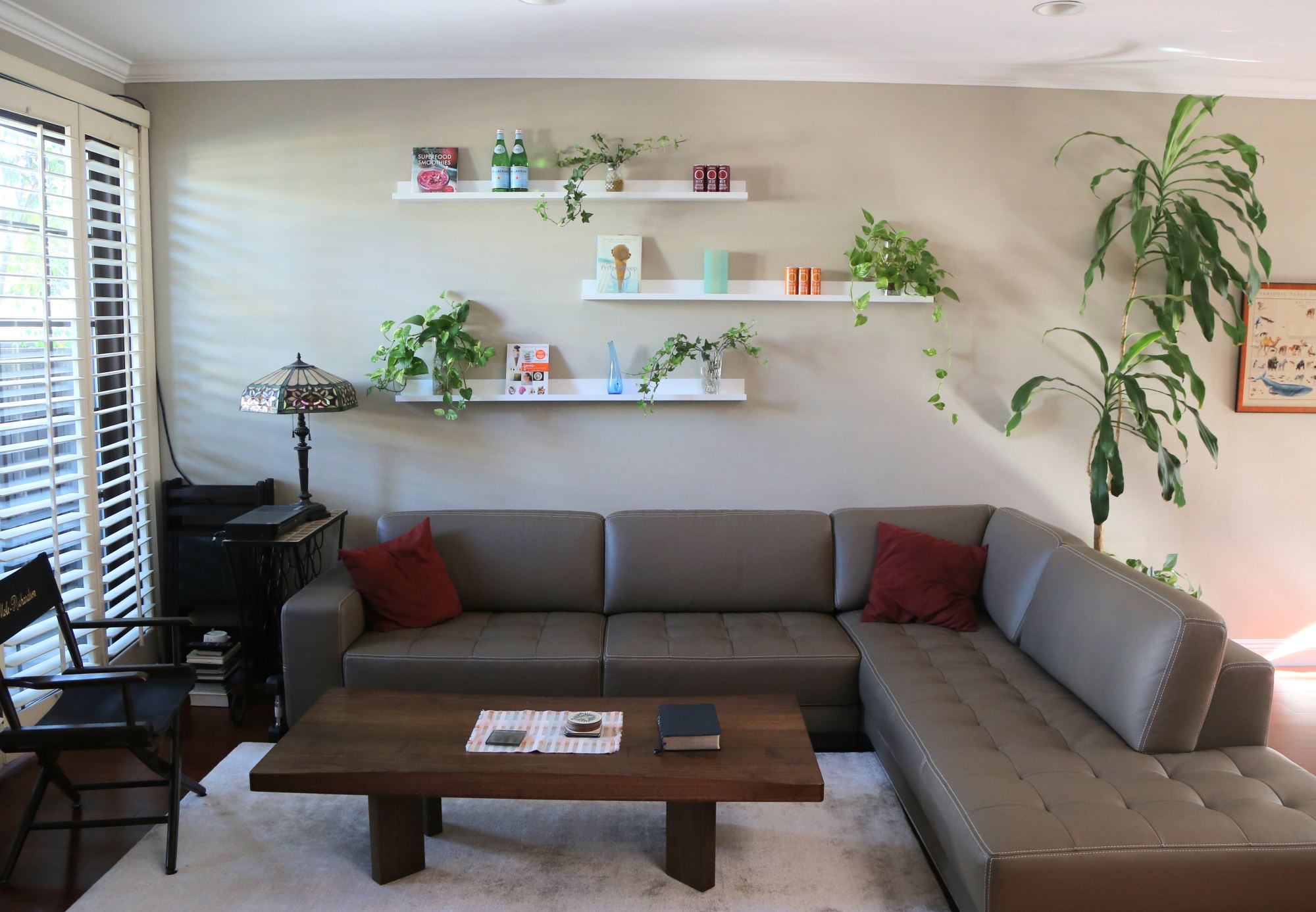 Floating living room shelves create a living wall