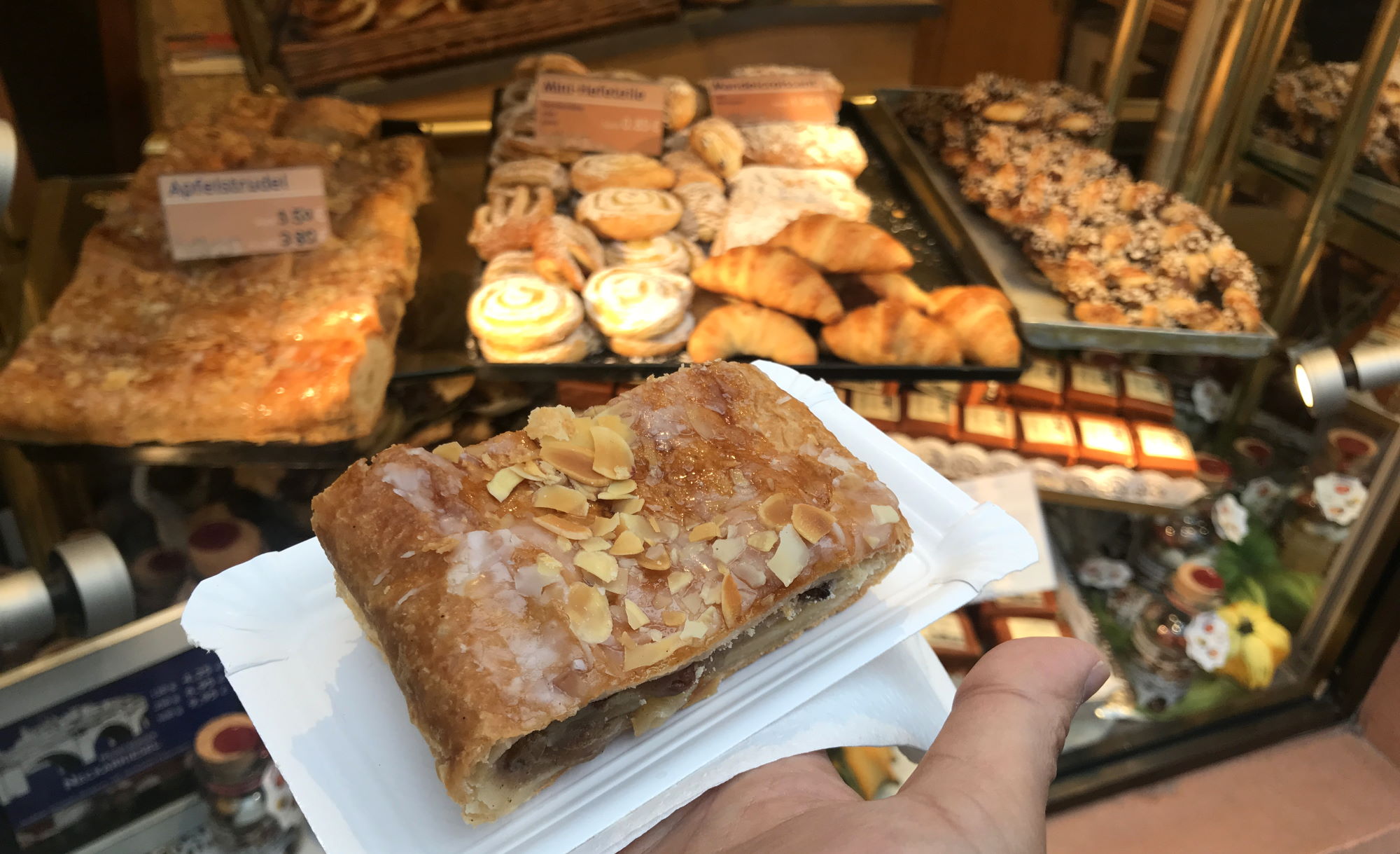 Apple strudel with amazing pastries in the background