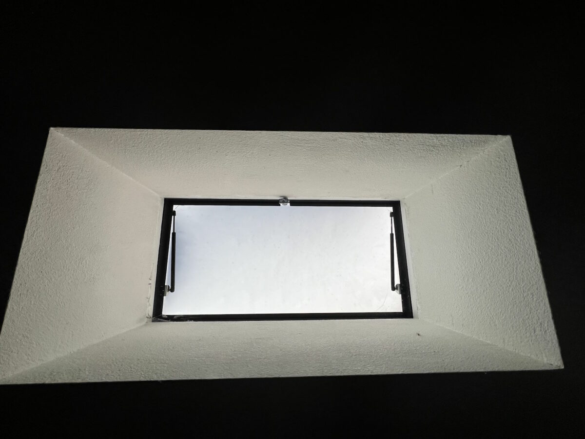 Skylight hatch with roof access
