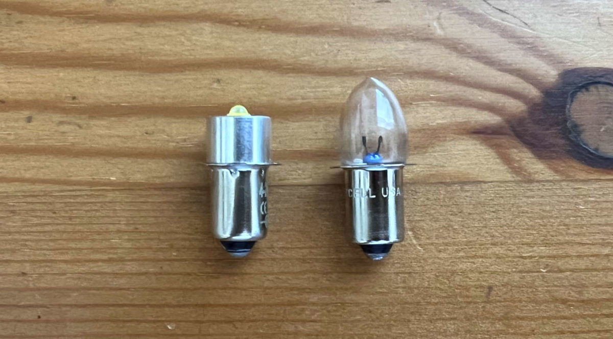 The TRLIFE LED Flashlight Bulb next to a Maglite incandescent bulb